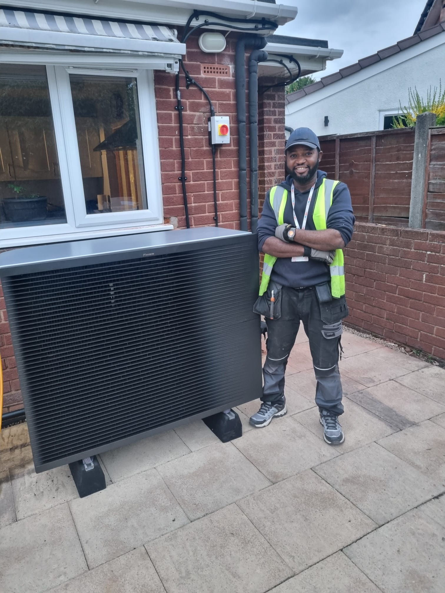 Gas engineer completing installation in West Midlands home